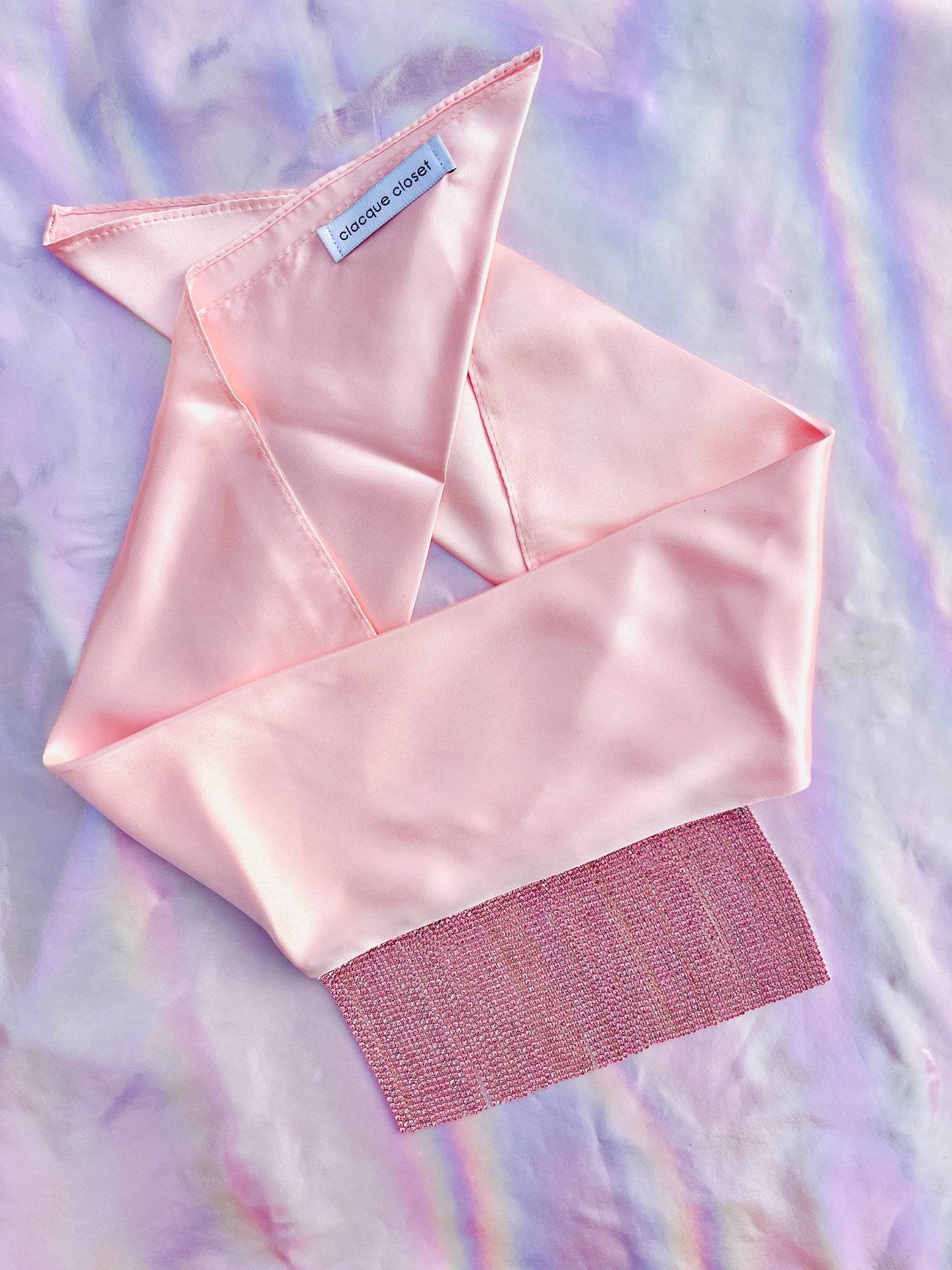 Xochi handmade pink satin bandana bang with pink rhinestone fringe laid flat