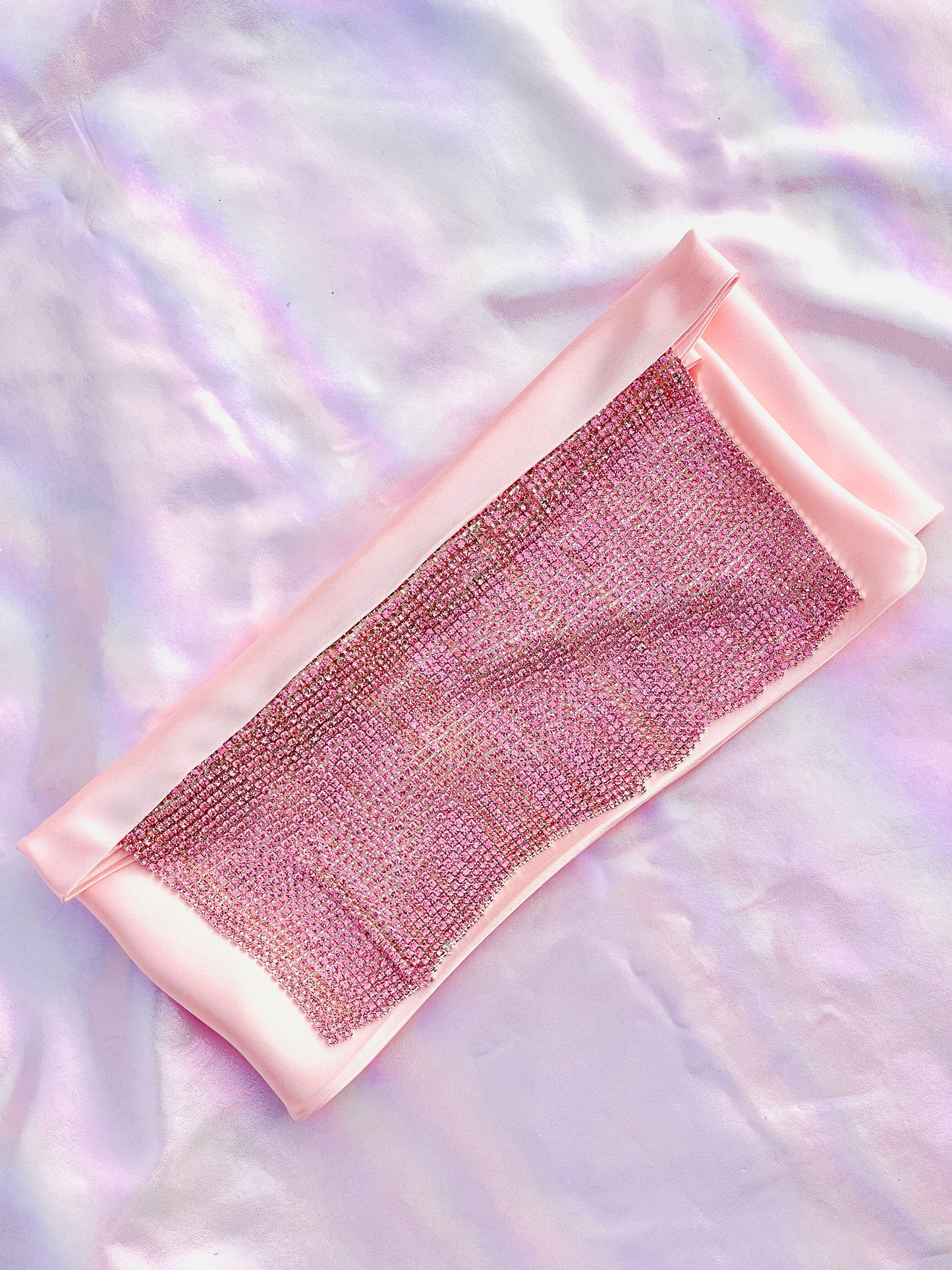 Xochi handmade pink satin bandana bang with pink rhinestone fringe laid flat