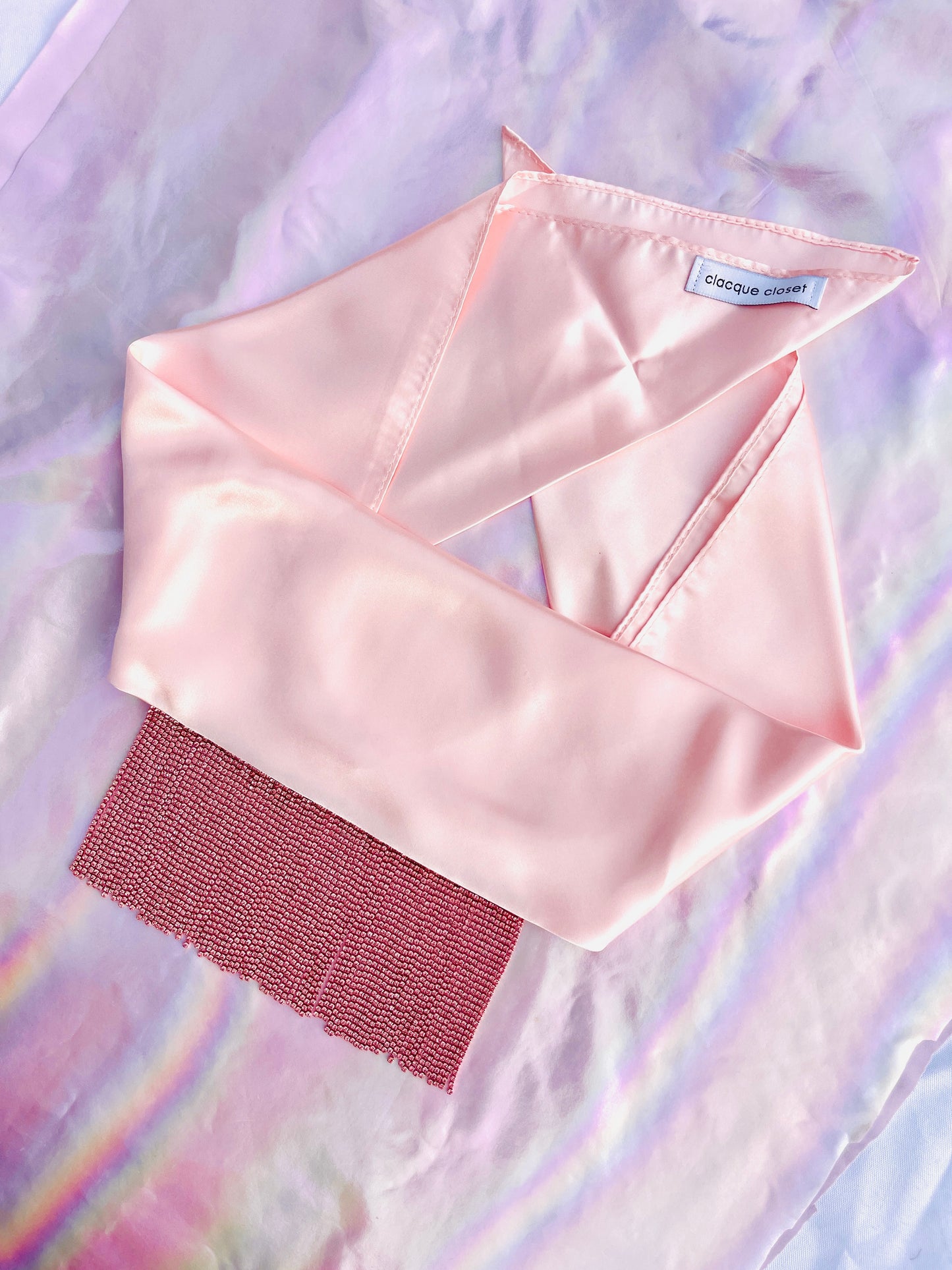Xochi handmade pink satin bandana bang with pink rhinestone fringe laid flat