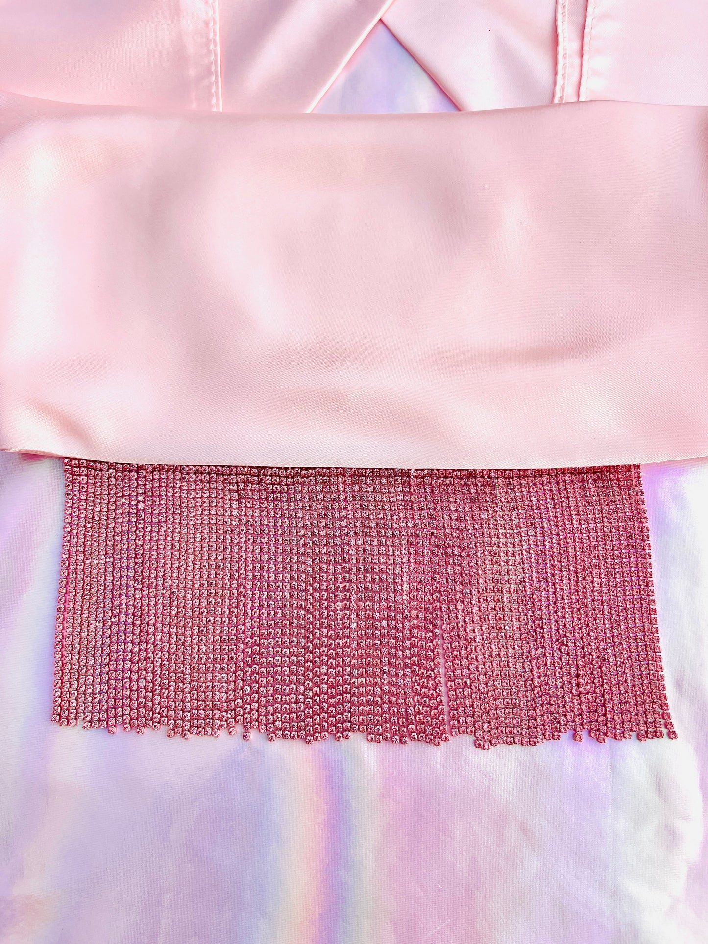Xochi handmade pink satin bandana bang with pink rhinestone fringe laid flat