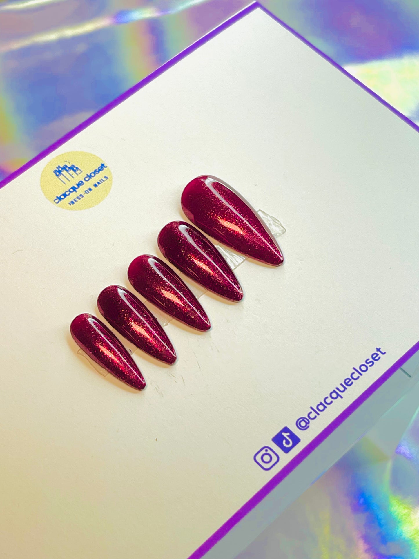 Vibrant red sparkle nails named 'Merry Berry Glitter,' featuring a dazzling, glittery finish that captures the festive spirit, perfect for holiday celebrations.