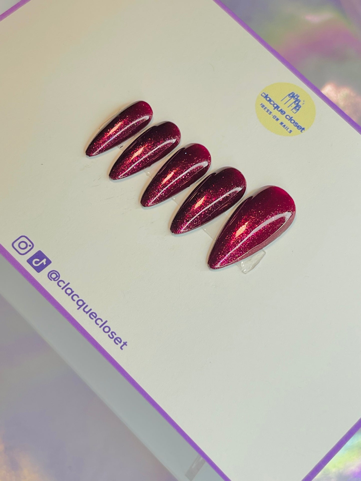 Vibrant red sparkle nails named 'Merry Berry Glitter,' featuring a dazzling, glittery finish that captures the festive spirit, perfect for holiday celebrations.