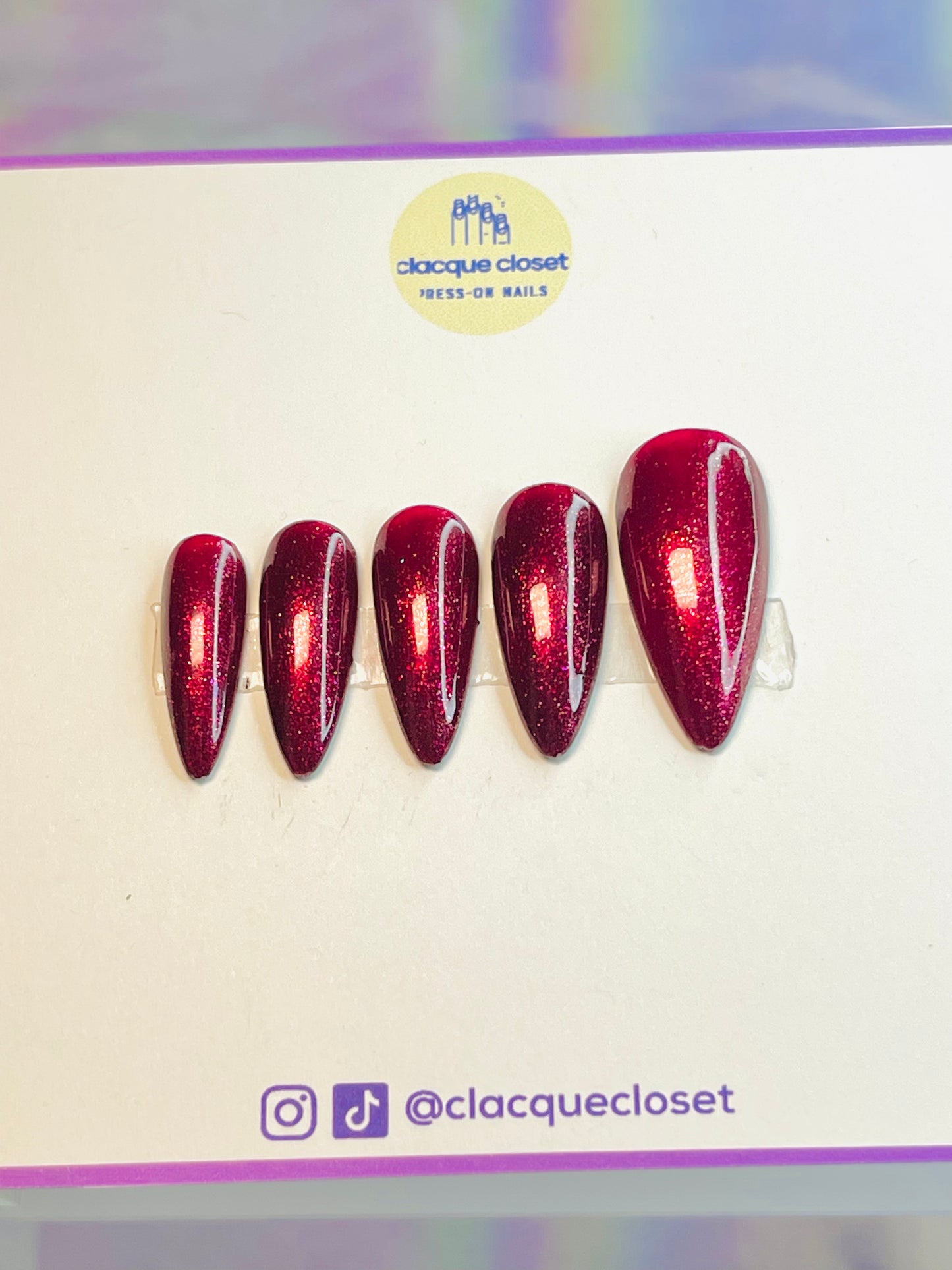 Vibrant red sparkle nails named 'Merry Berry Glitter,' featuring a dazzling, glittery finish that captures the festive spirit, perfect for holiday celebrations.