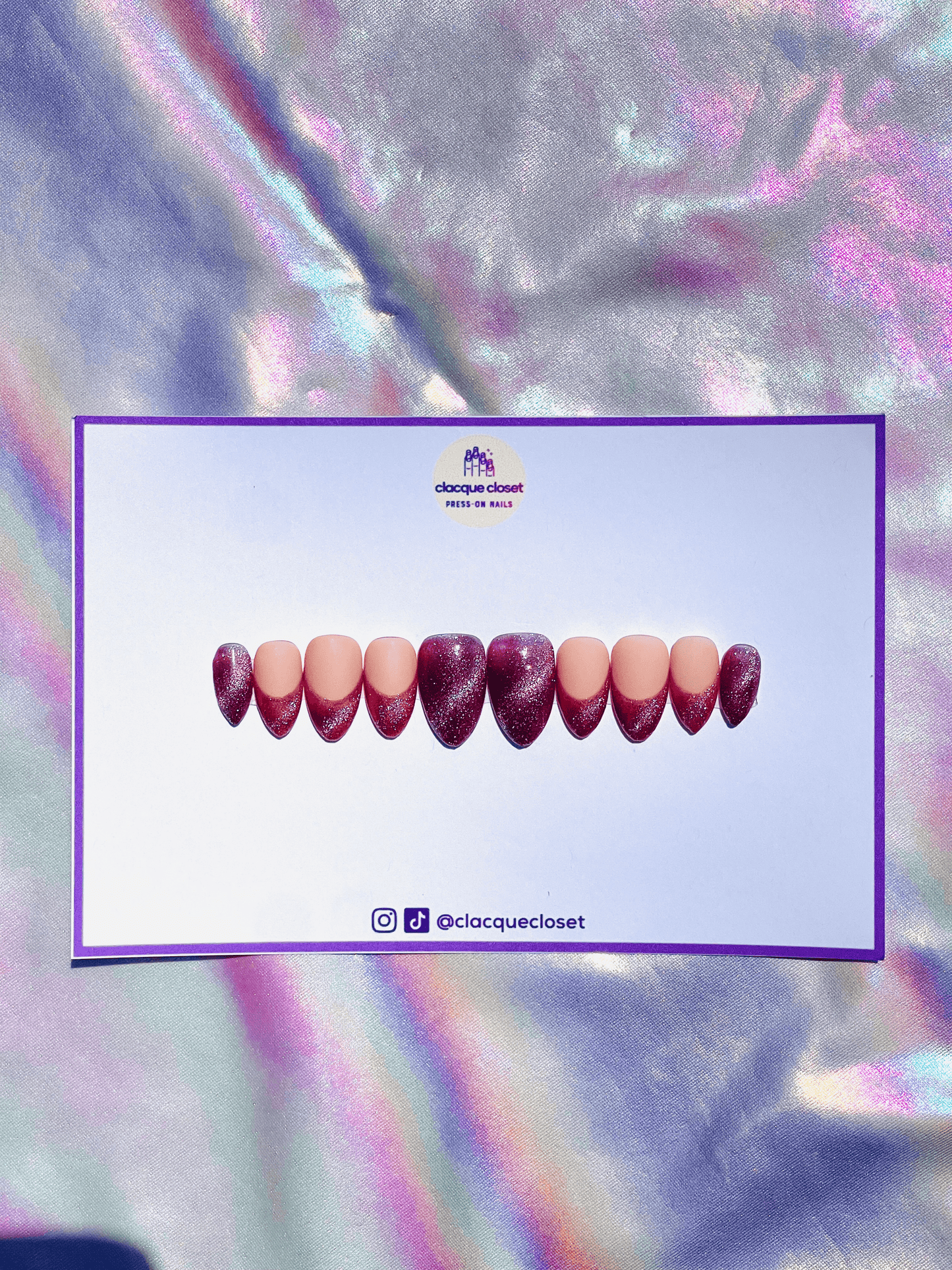 Medium almond-shaped press-on nails featuring a pink cat eye gel design with elegant French tips.