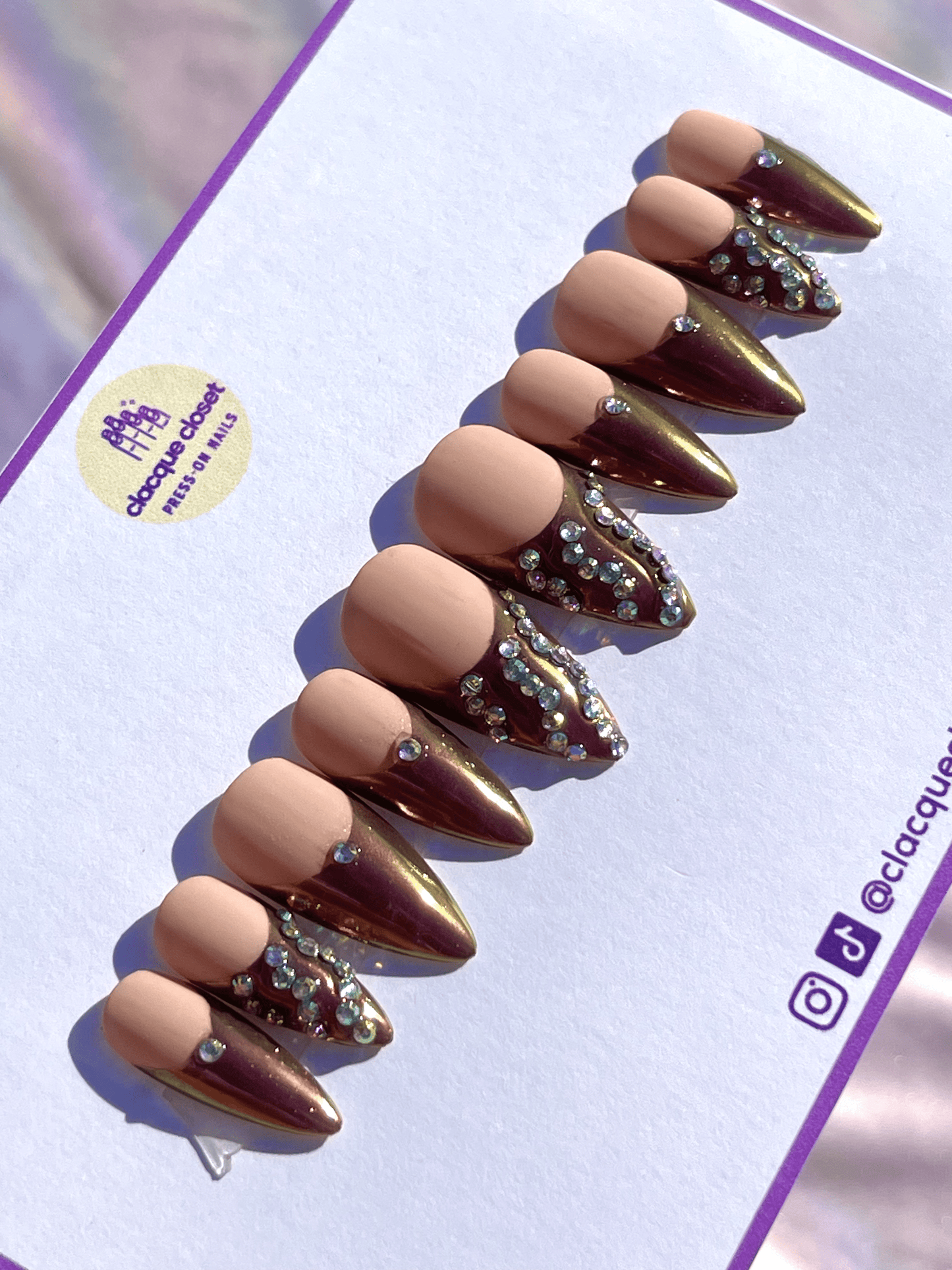 Press-on nails with multicolor chrome French tips, adorned with rhinestones for a dazzling and colorful look.