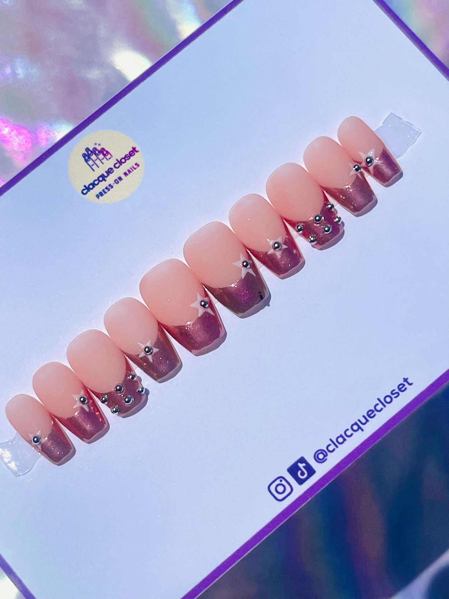 Short coffin-shaped press-on nails in pink chrome with a chic French tip design for a sleek and modern look.