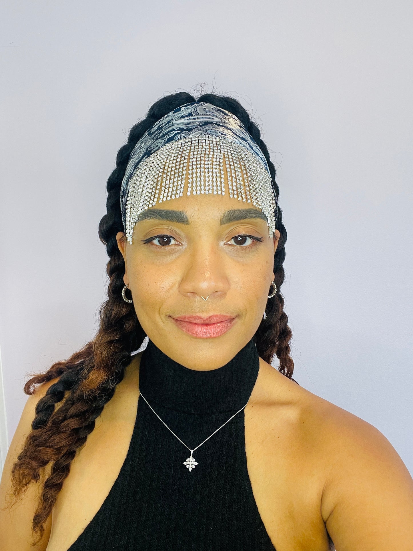 Model wearing the Midnight Eve blue paisley bandana with rhinestone fringe, tied at the front