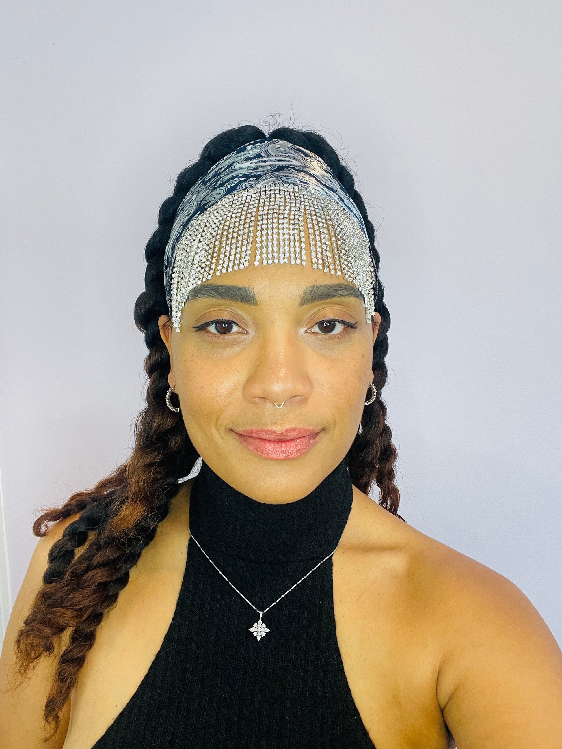 Model wearing the Midnight Eve blue paisley bandana with rhinestone fringe, tied at the front