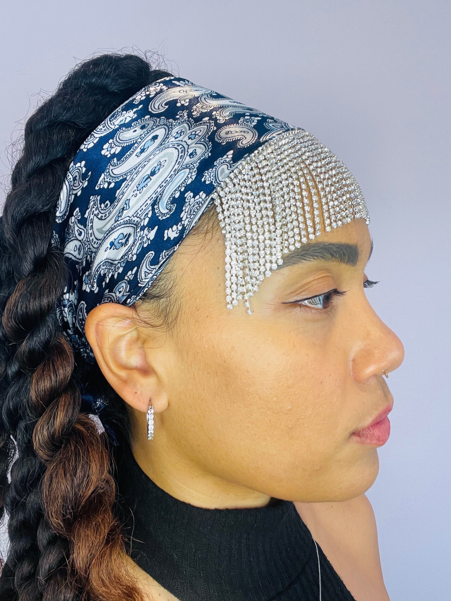 Side angle of the Midnight Eve bandana showing its paisley pattern and sparkly fringe