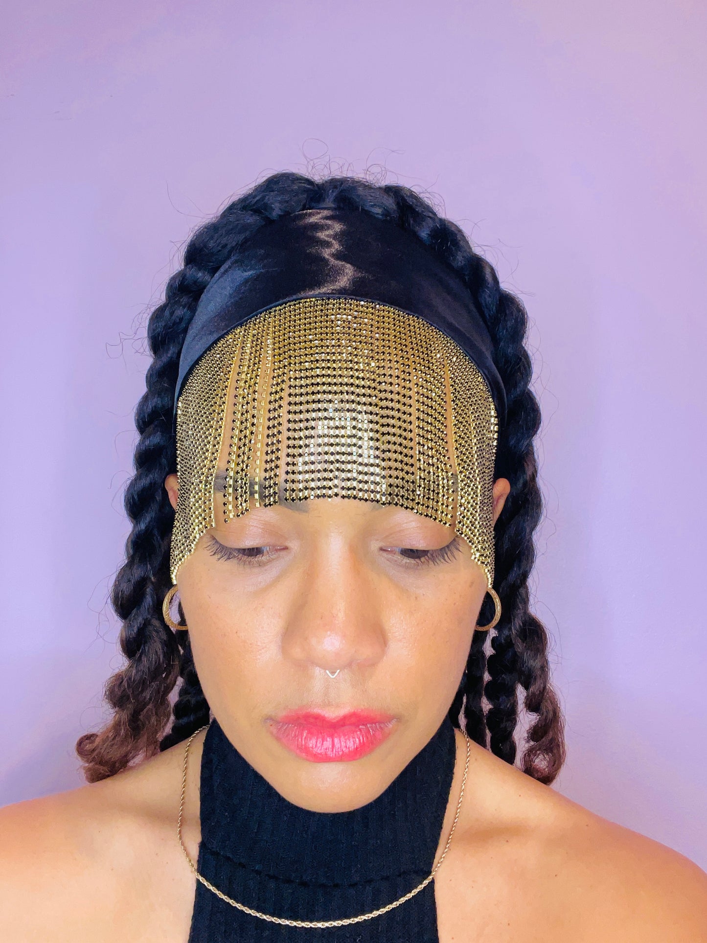 Model wearing the Minerva black and gold bandana bang with front fringe and tied in the back