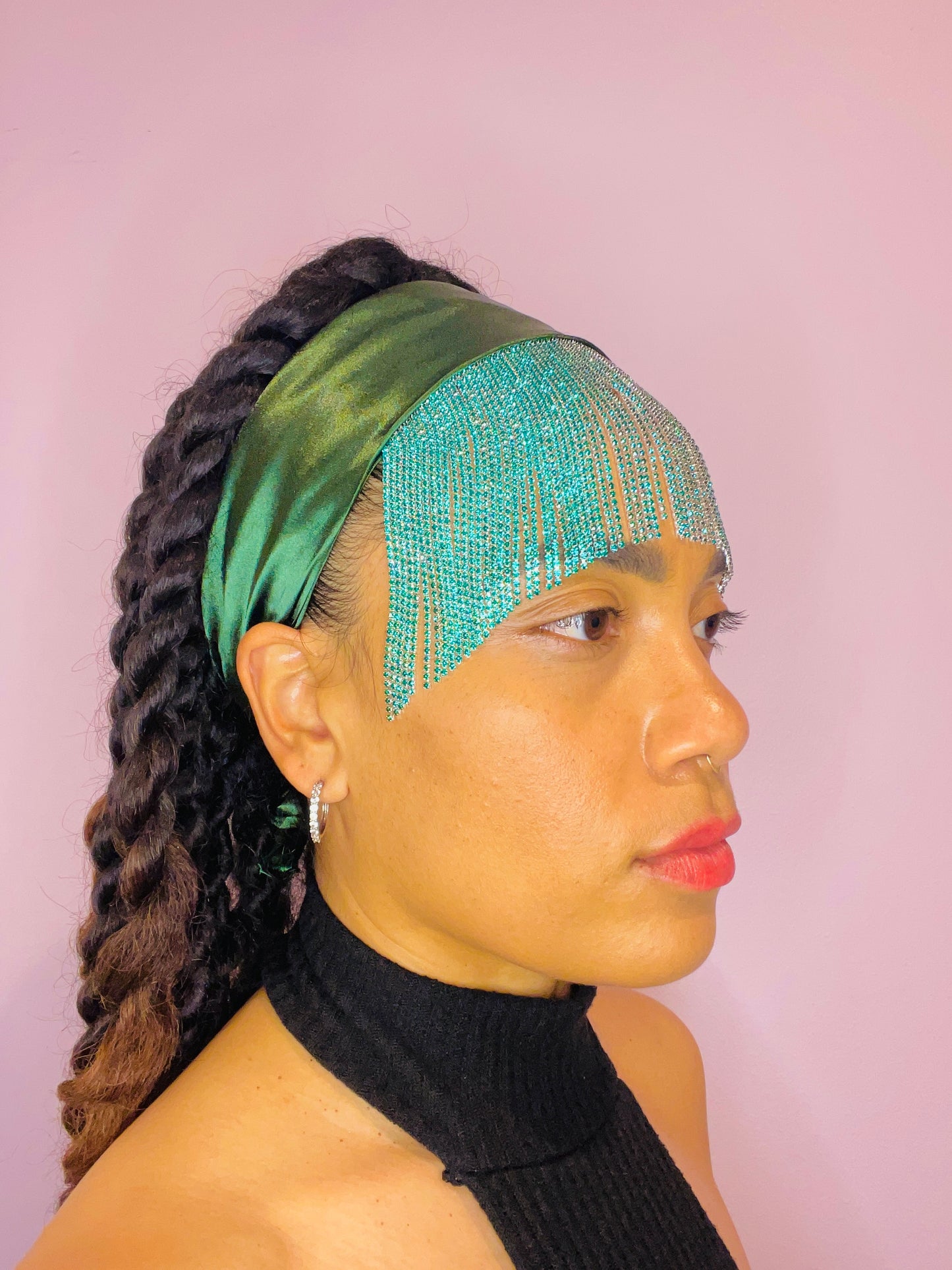 Model wearing the Freya emerald green bandana bang tied in the back with turquoise fringe detail.