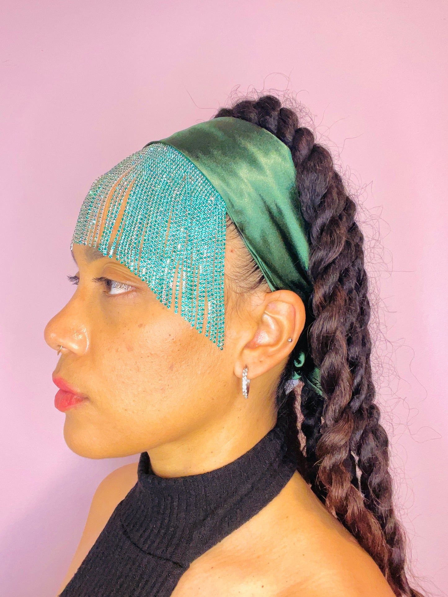 Model wearing the Freya emerald green bandana bang tied in the back with turquoise fringe detail.