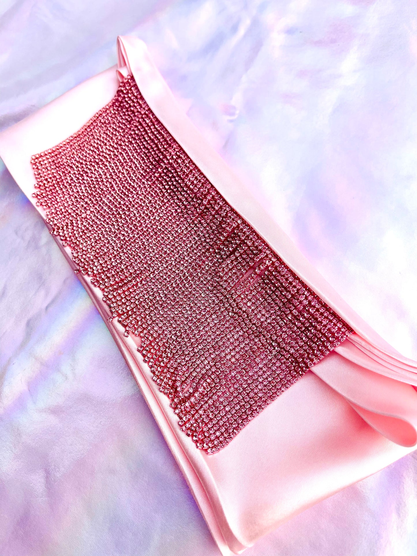 Xochi handmade pink satin bandana bang with pink rhinestone fringe laid flat