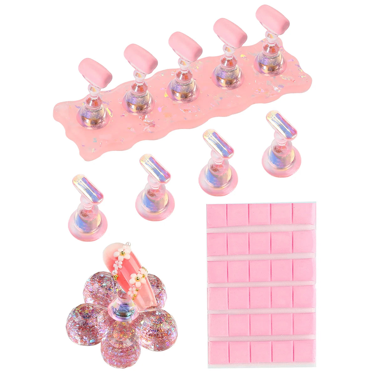 Set of nail art tools including a pink stand with nail forms and a pink square block on a white background.