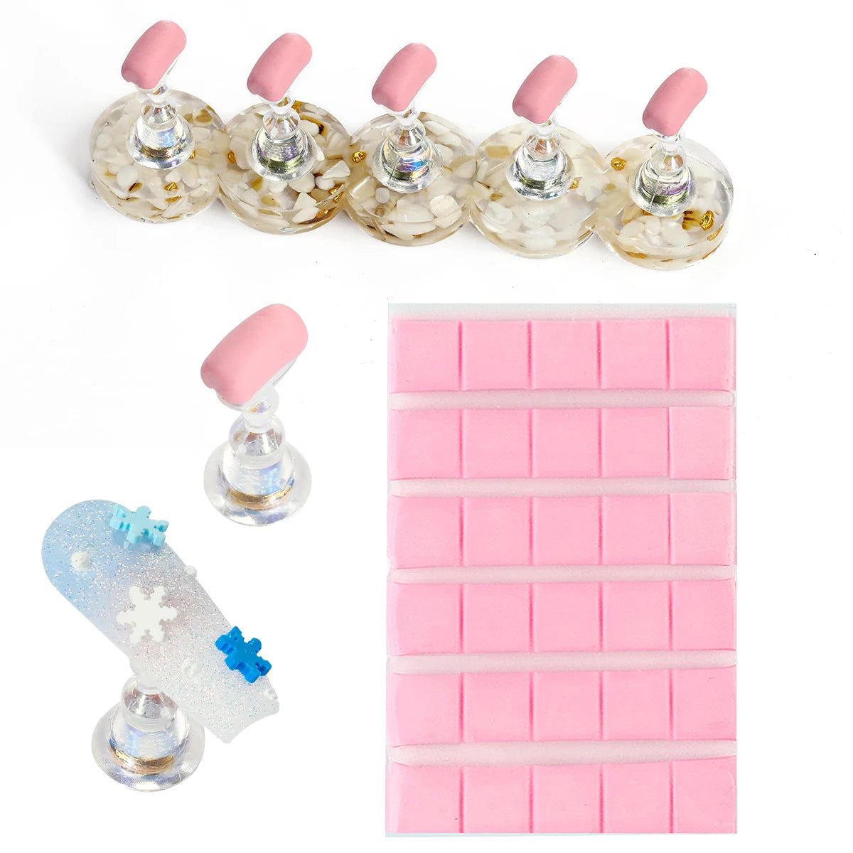 Set of silicone mold tools with pink silicone sheets on a white background