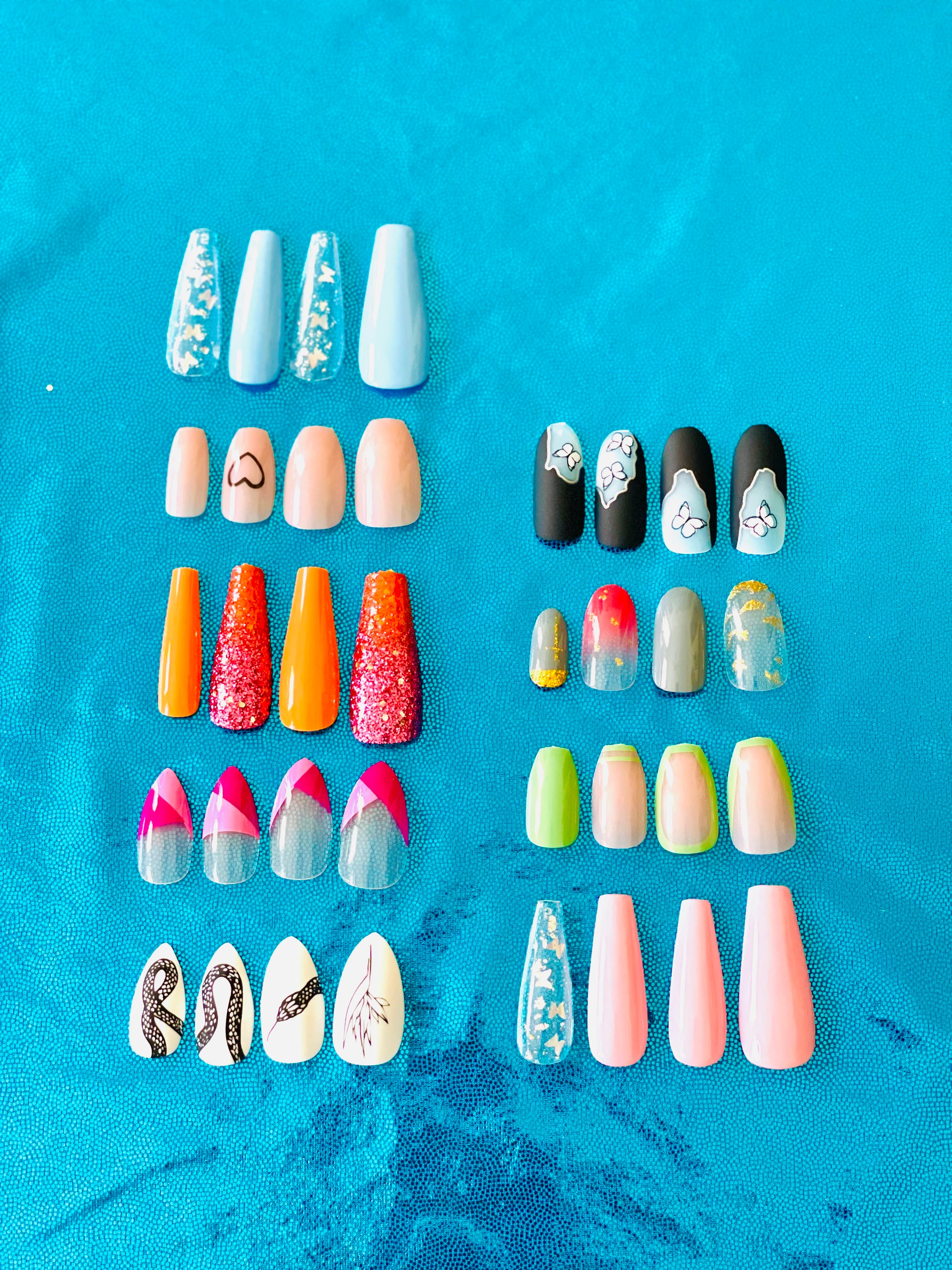 Image featuring a collection of nails in diverse shapes such as round, square, almond, and coffin, with varying lengths from short to extra-long, and an array of colors from pastel to deep shades, arranged for visual comparison.