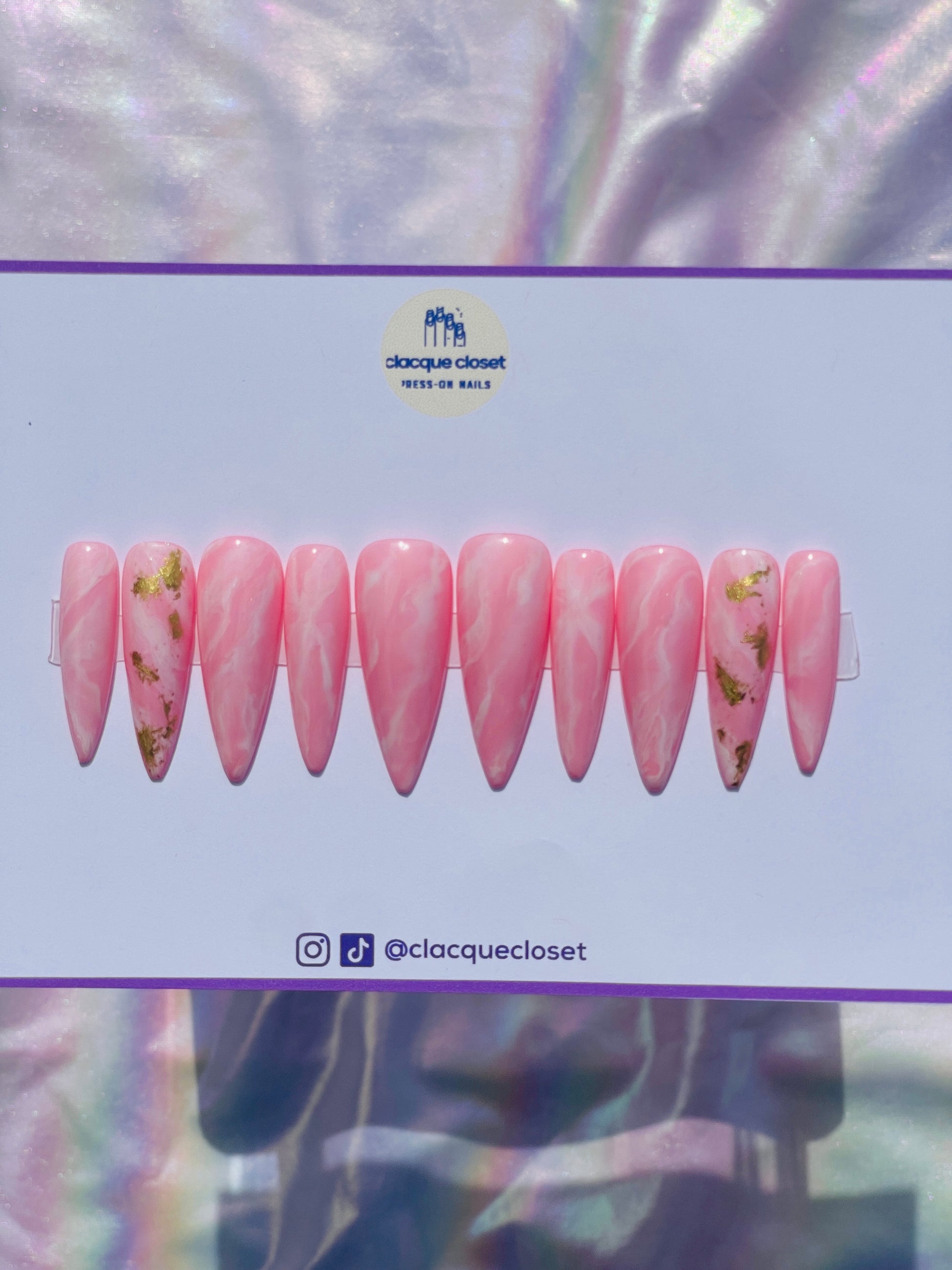 Long stiletto nails designed to resemble the natural beauty of pink rose quartz, reflecting light for a soft and romantic effect.