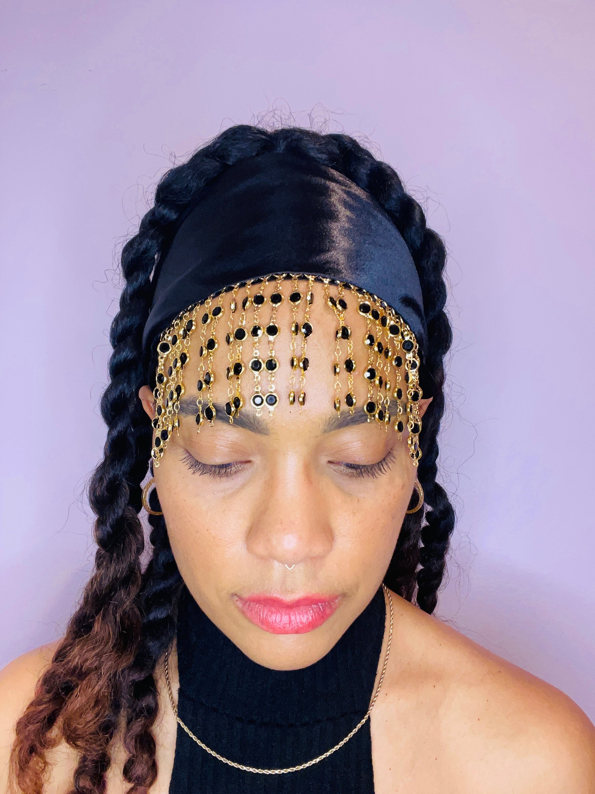 Model wearing the Kali black bandana bang with gold beaded fringe.