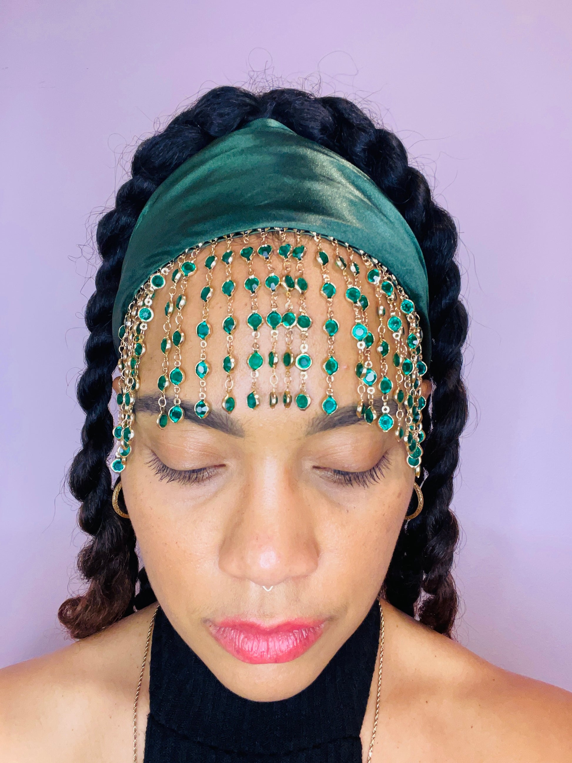 Model wearing the Demeter green bandana bang with green and gold beaded fringe tied in the back.