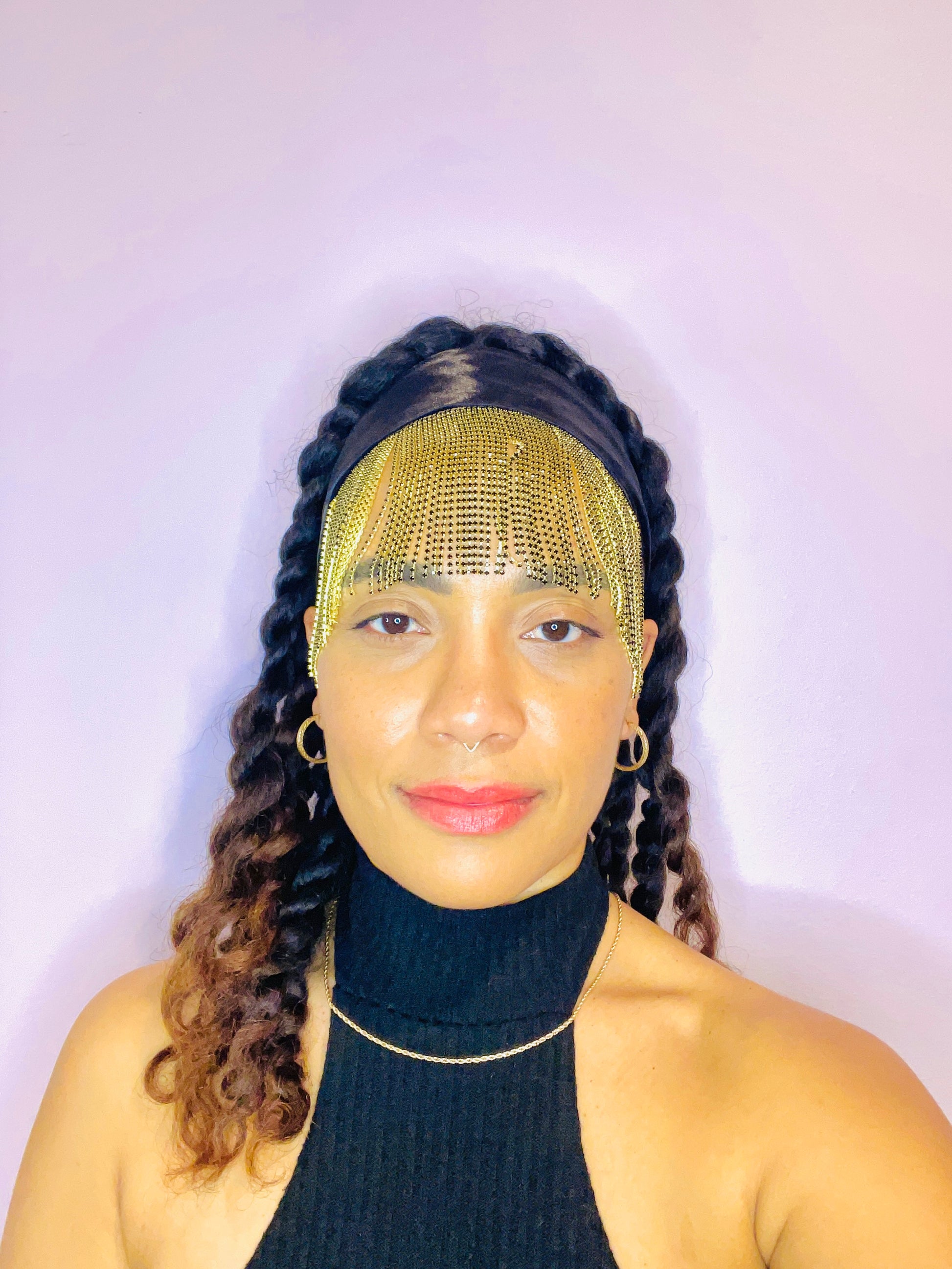 Model wearing the Minerva black and gold bandana bang with front fringe and tied in the back